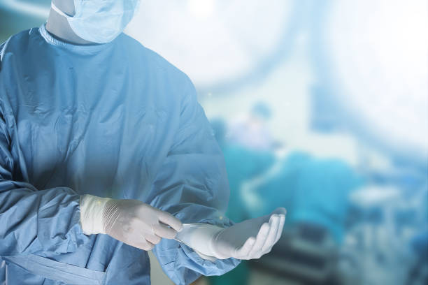 medical team preparing equipment for surgery in operation room